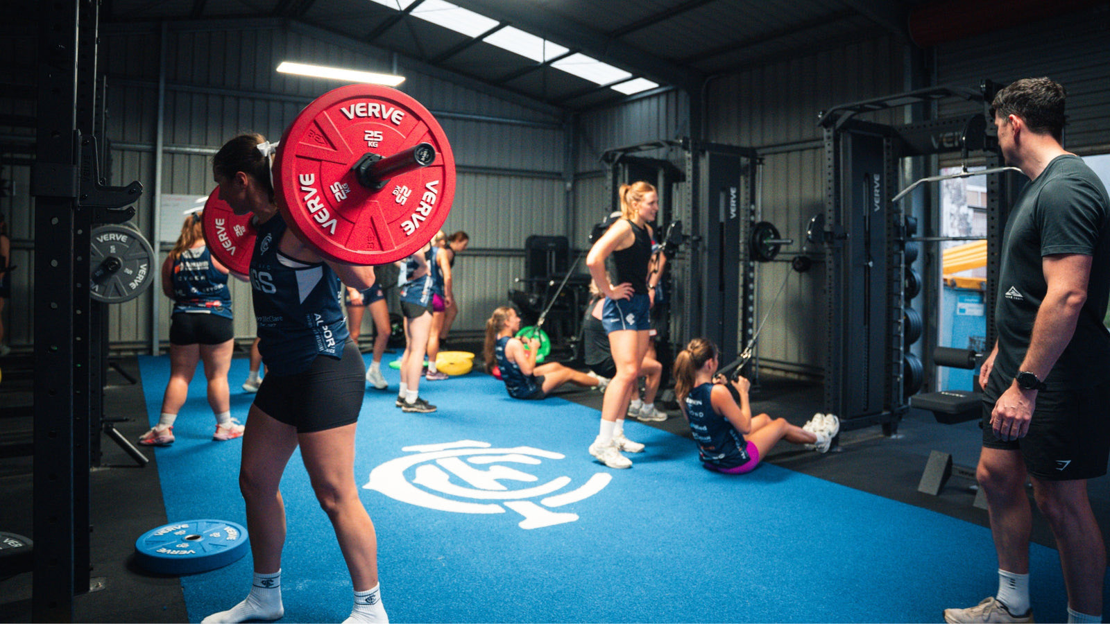 The finished Coorparoo Kings gym with players training on the blue floor
