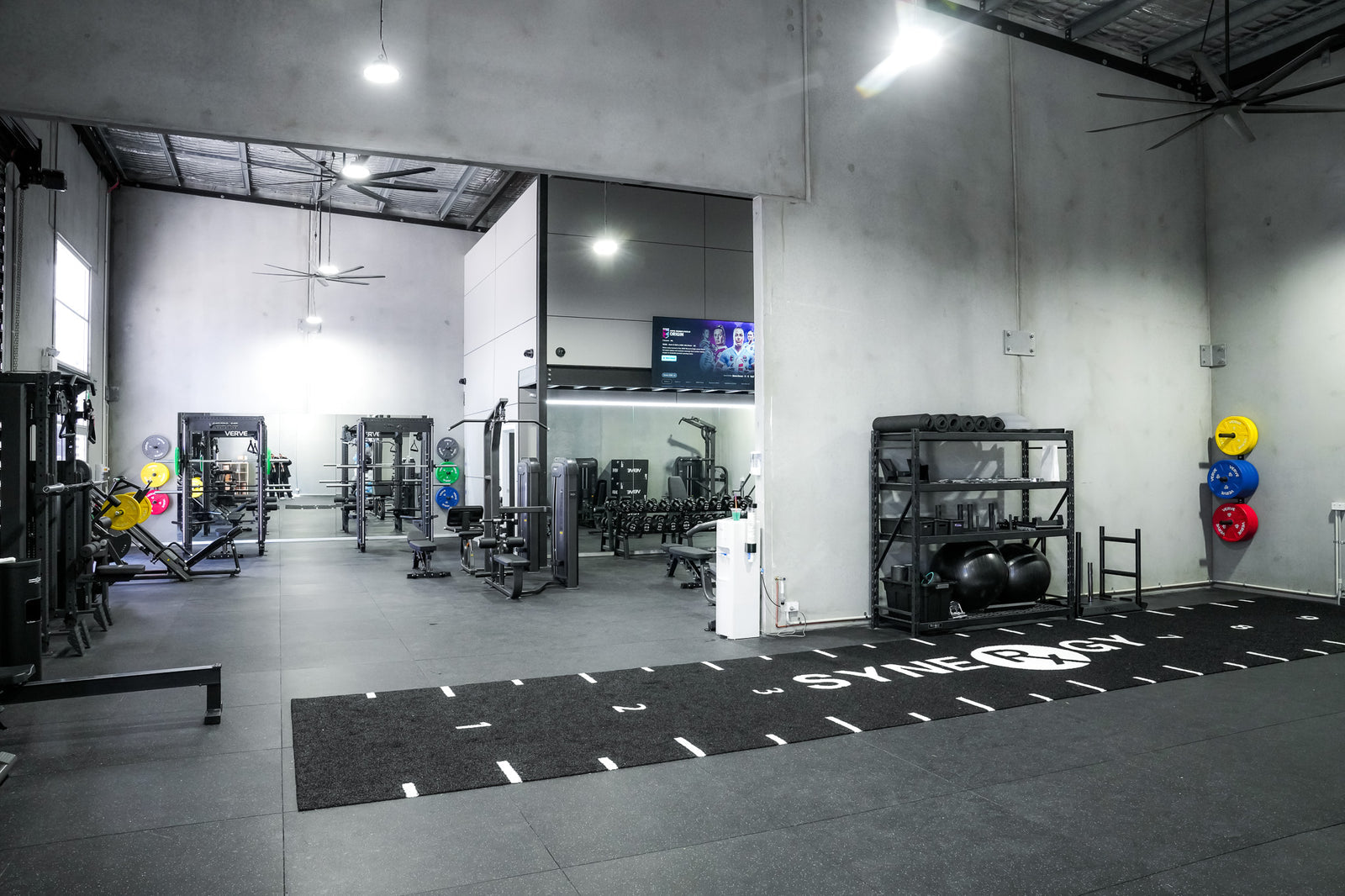 The finished Synergy Rx gym with its branded turf lane